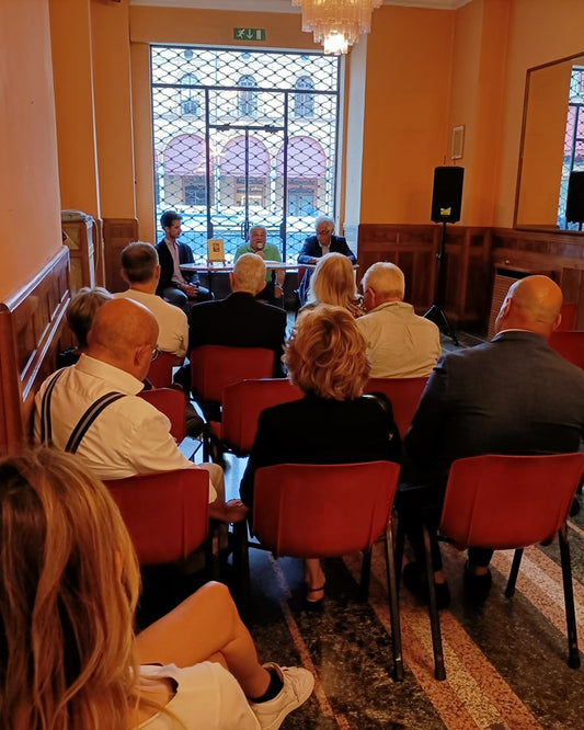 Presentazione di La corsa più bella del mondo di Tommaso Panozzo e Gianni Morolli a Imola durante la 1000 Miglia 2023